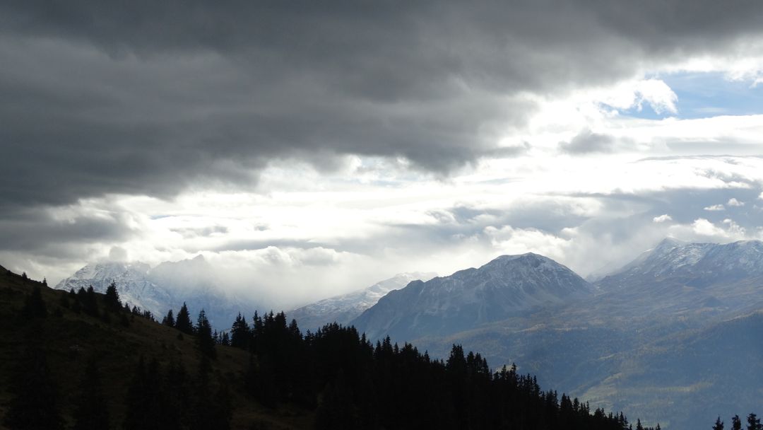 Dramatic Clouds Over Snow-Capped Mountain Range - Free Images, Stock Photos and Pictures on Pikwizard.com