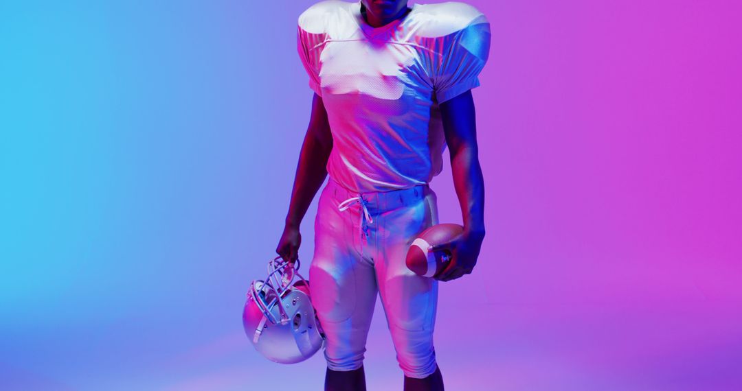 Image of portrait of african american american football player over blue to pink neon background - Free Images, Stock Photos and Pictures on Pikwizard.com