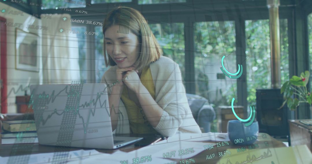Woman Analyzing Financial Data on Laptop with Digital Interface