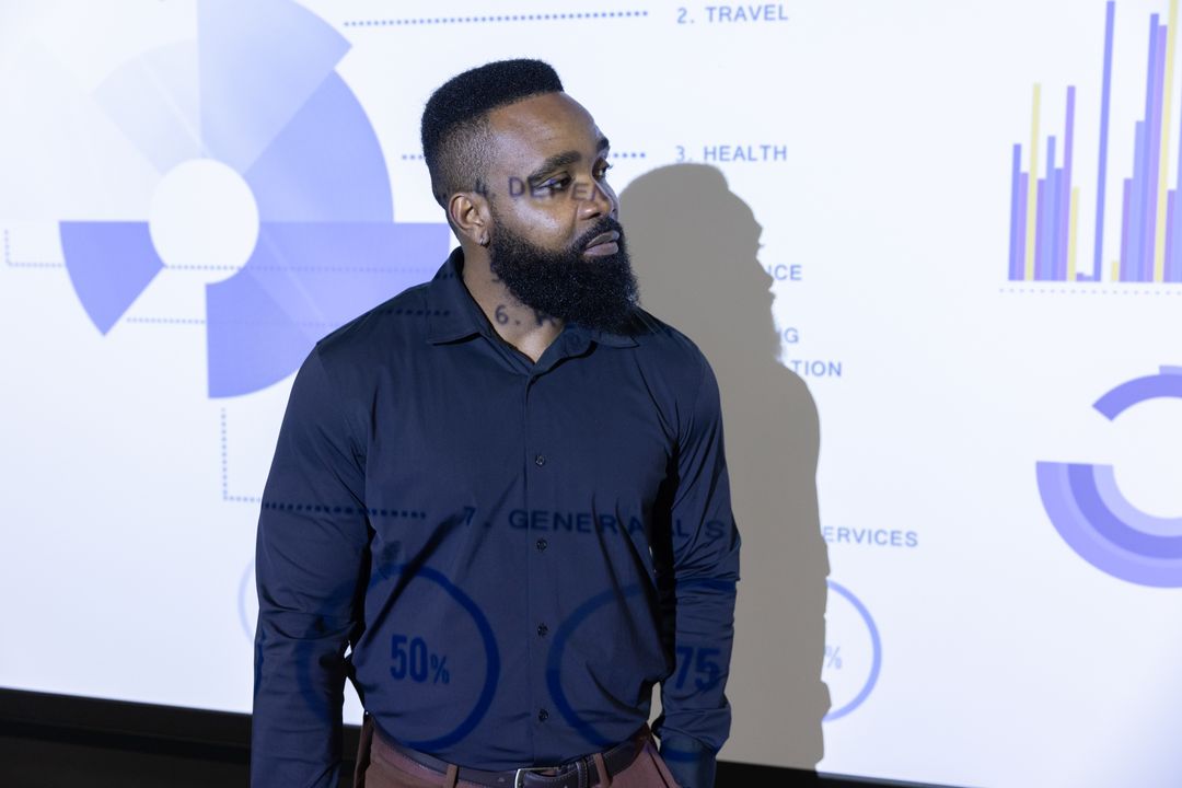 Professional Businessman Analyzing Data Charts in Conference Room