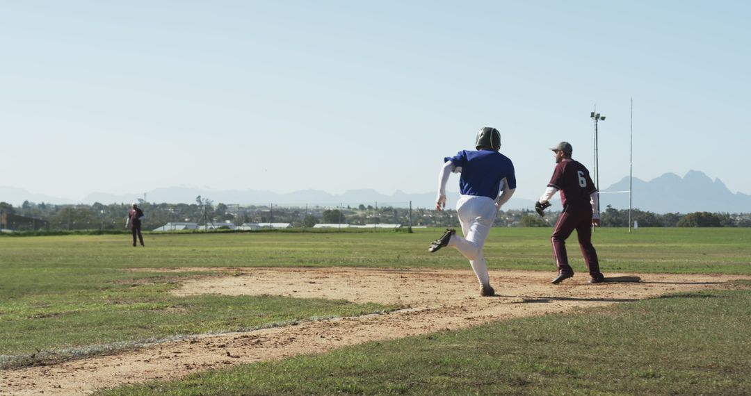 Baseball Player Running Towards Base During Game