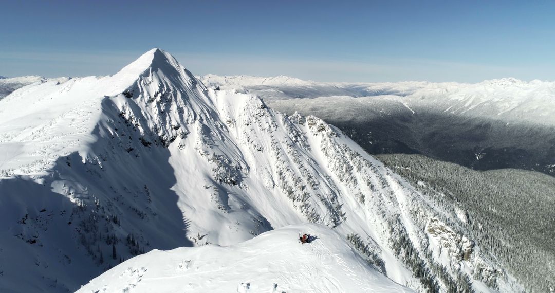 Snow-Covered Mountain Range with Snowcapped Peaks and Winter Landscape - Free Images, Stock Photos and Pictures on Pikwizard.com