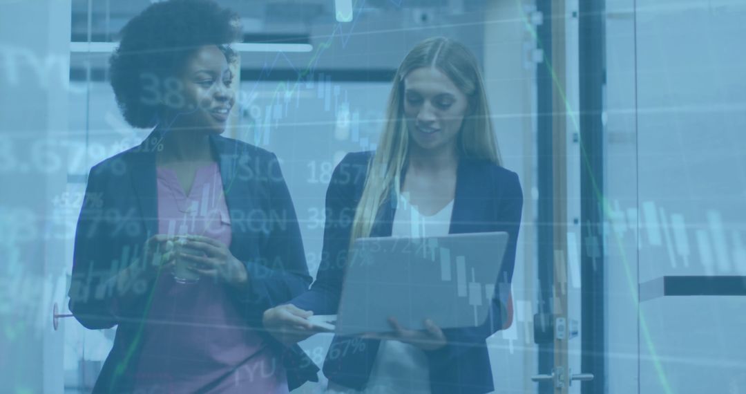 Diverse Business Colleagues Analyzing Financial Data on Laptop
