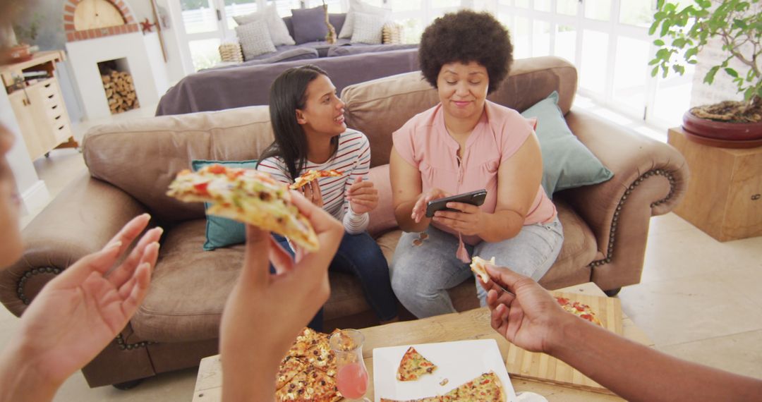 Family Enjoying Pizza Together in Cozy Living Room - Free Images, Stock Photos and Pictures on Pikwizard.com