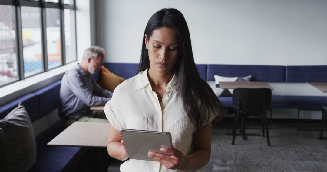 Businesswoman Using Tablet in Modern Office Setting