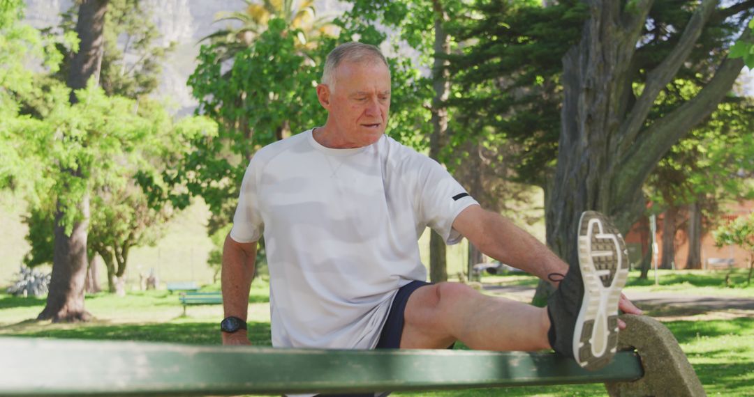 Active Senior Man Stretching on Park Bench - Free Images, Stock Photos and Pictures on Pikwizard.com