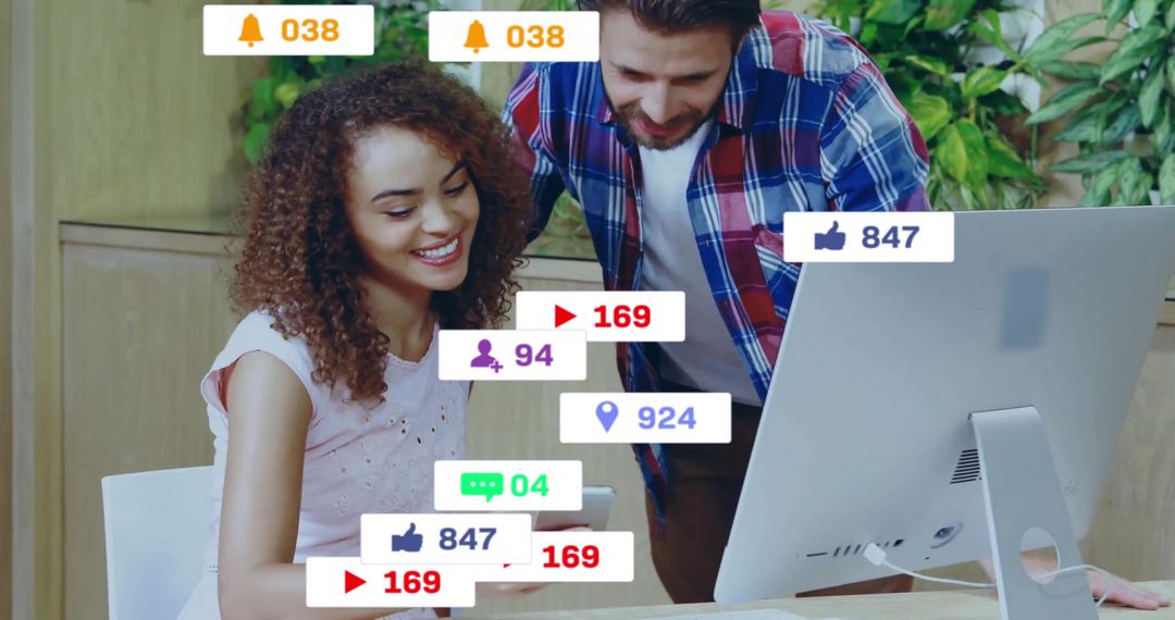 Colleagues Collaborating in Modern Office with Social Media Notifications