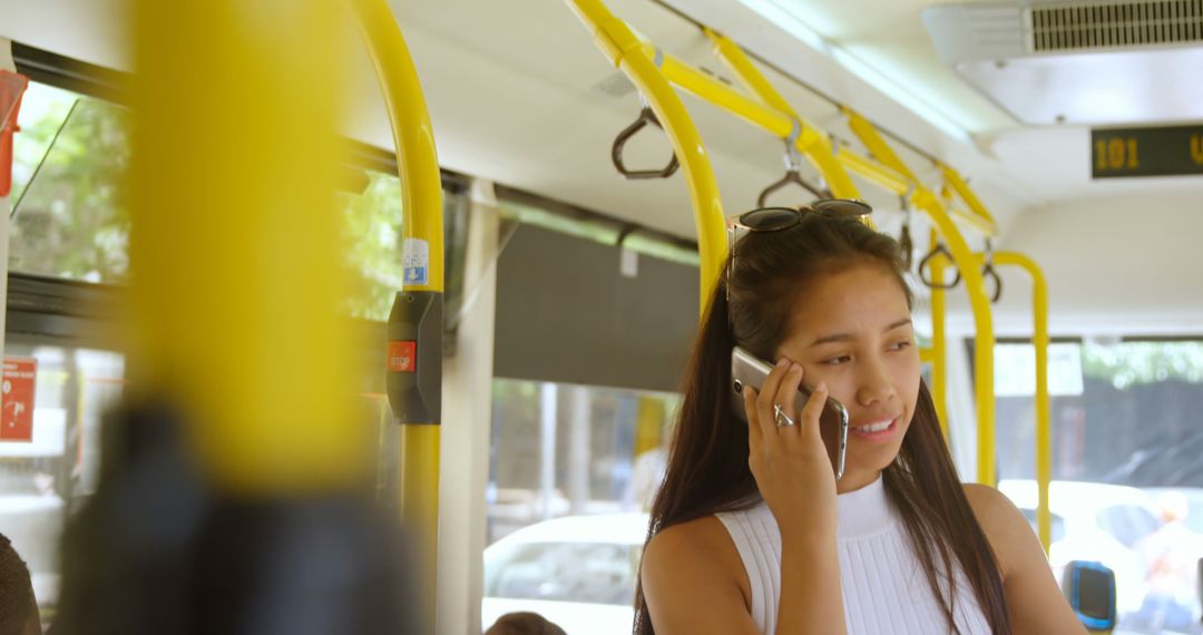 Young Woman Talking on Phone While Riding Bus - Free Images, Stock Photos and Pictures on Pikwizard.com