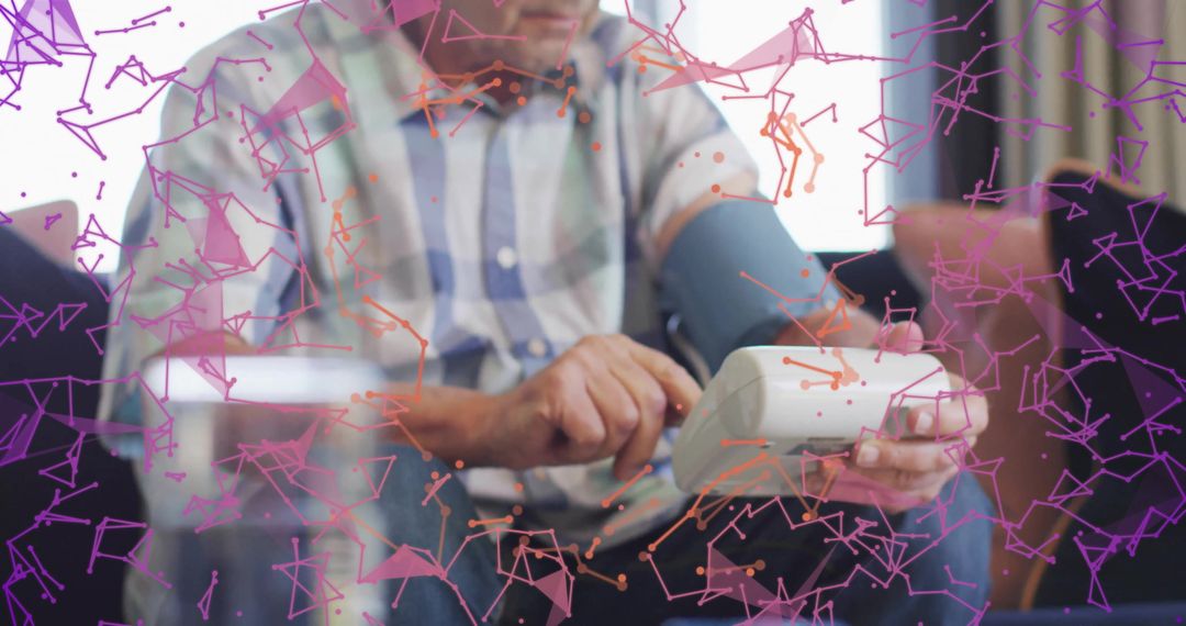 Elderly Man Using Blood Pressure Monitor with Futuristic Graphics