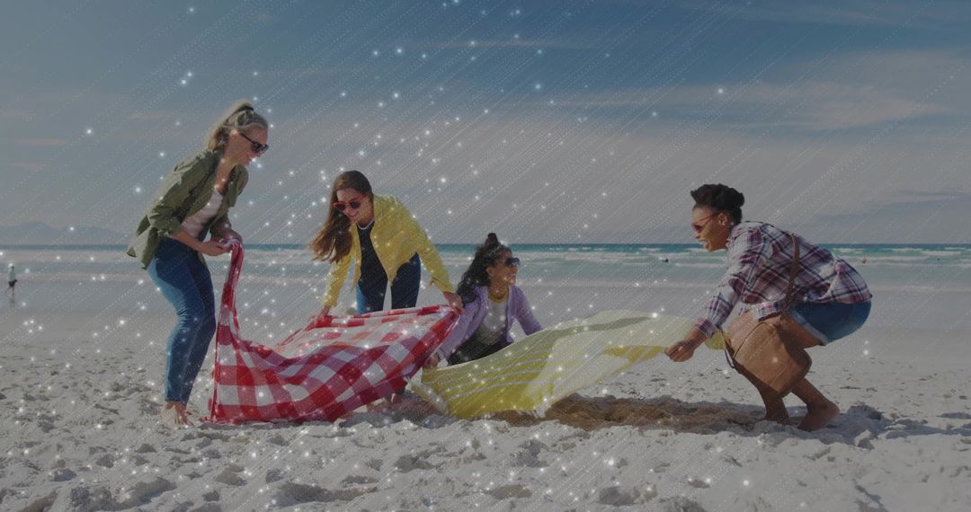 Group of Diverse Friends Setting up Beach Picnic on Sunny Day