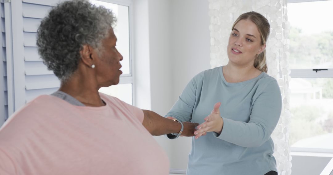 Physical Therapist Guiding Senior Woman in Exercise Routine - Free Images, Stock Photos and Pictures on Pikwizard.com