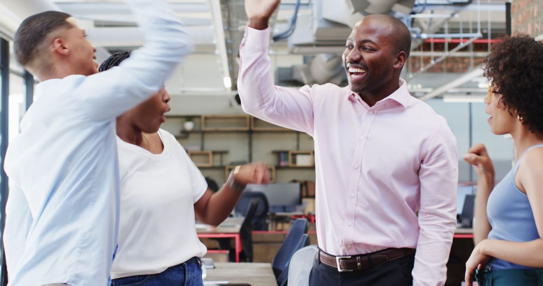 Diverse Corporate Team Celebrating Success with High Fives