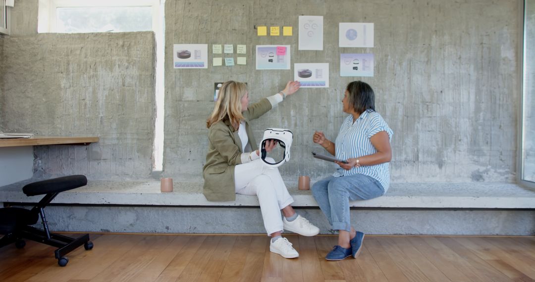Diverse Coworkers Collaborating with VR Headset and Tablet in Modern Office