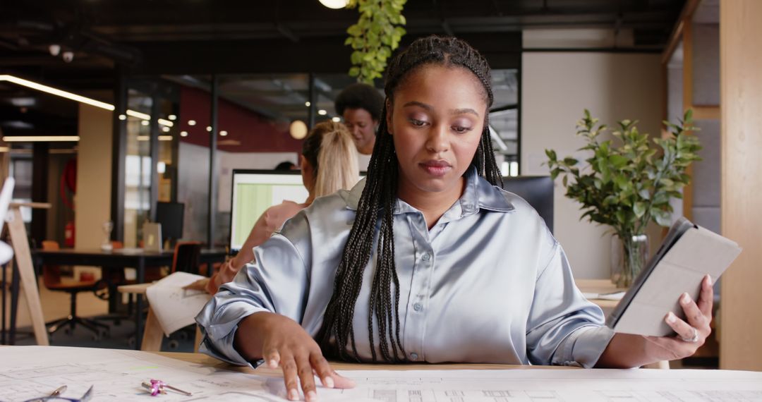 African American Architect Working on Blueprint in Modern Office - Free Images, Stock Photos and Pictures on Pikwizard.com