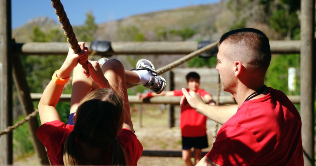 Instructor Guiding Children on Outdoor Obstacle Course - Free Images, Stock Photos and Pictures on Pikwizard.com