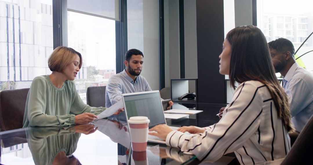 Professional Office Meeting with Diverse Team Discussing Projects