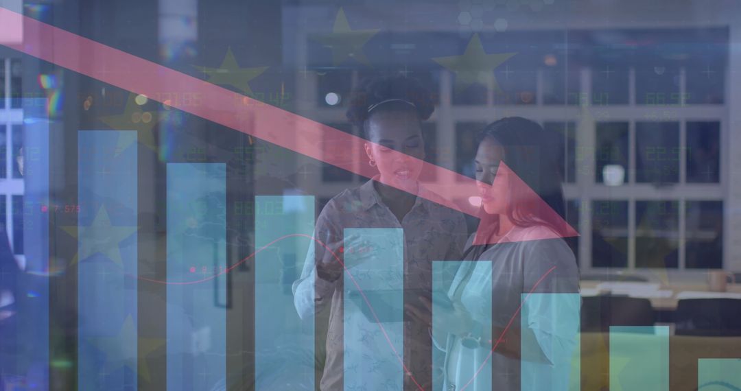 Diverse Businesswomen Analyzing Financial Decline with Digital Graphs