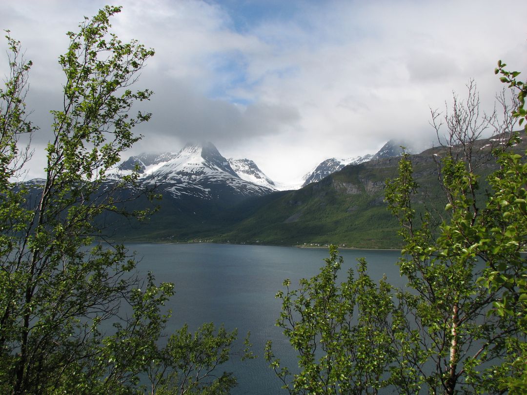 Serene Mountain Lake Panorama with Snow-Capped Peaks