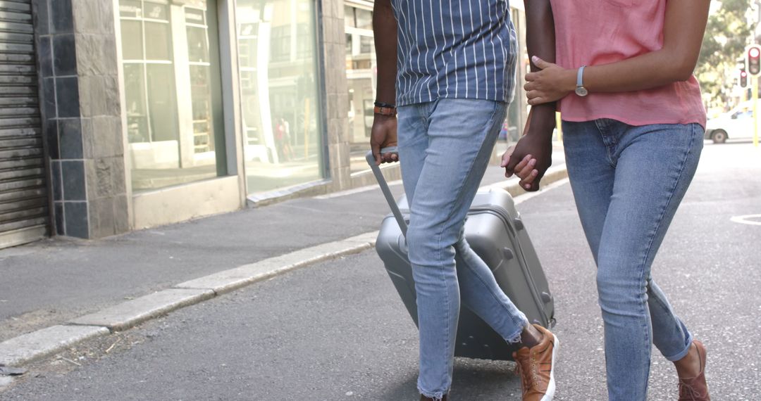 Diverse Couple Enjoying City Walk with Suitcase