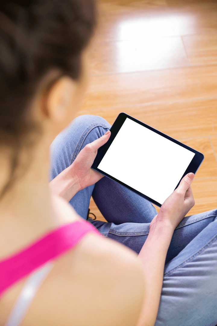 Transparent Tablet Screen Woman Sitting on Floor Using Device