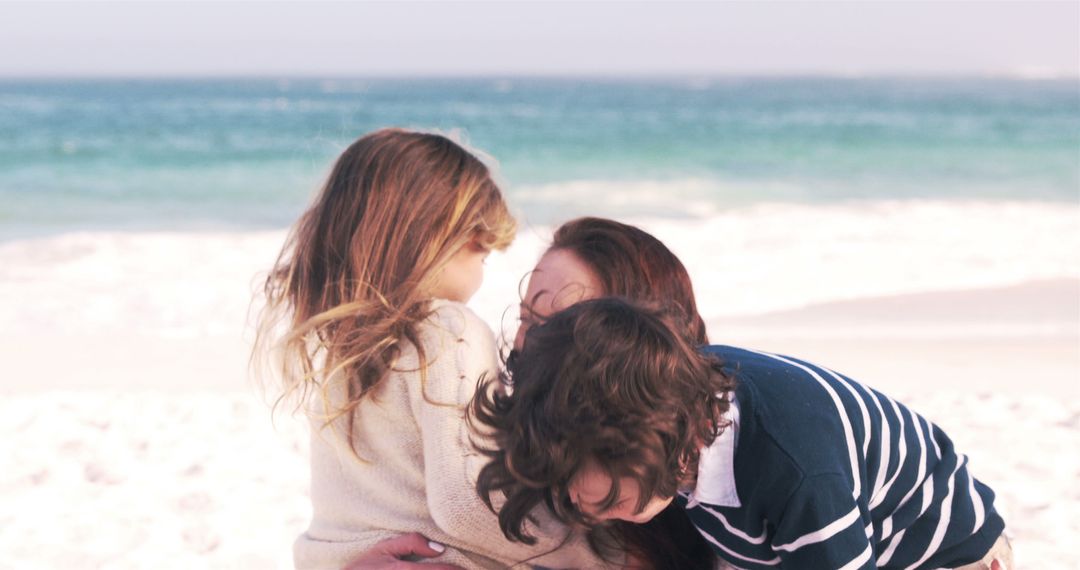 Family Sharing a Warm Embrace on a Sunny Beach - Free Images, Stock Photos and Pictures on Pikwizard.com