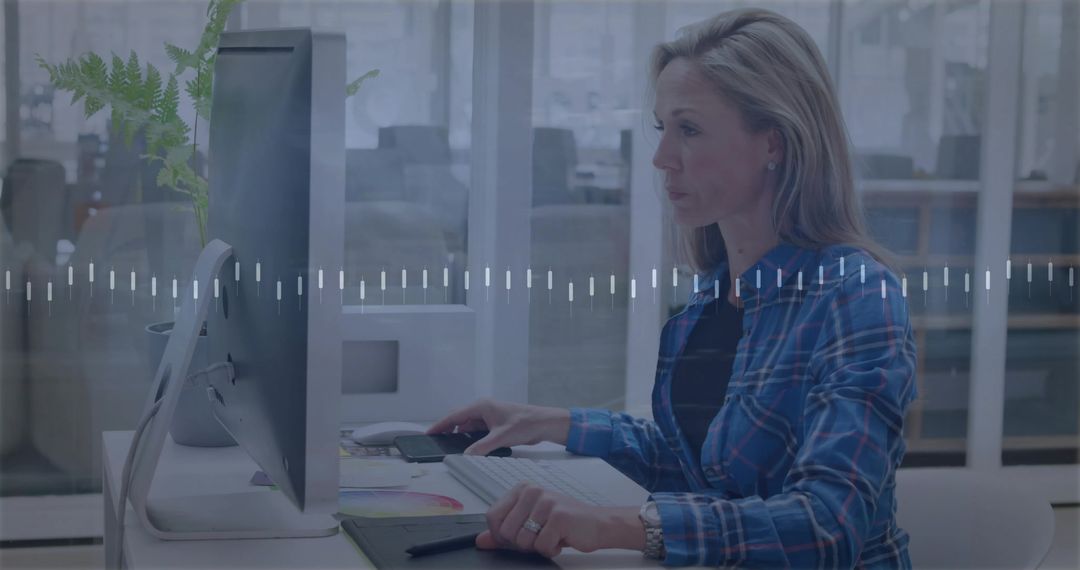 Professional Woman Using Graphics Tablet at Modern Office Desk
