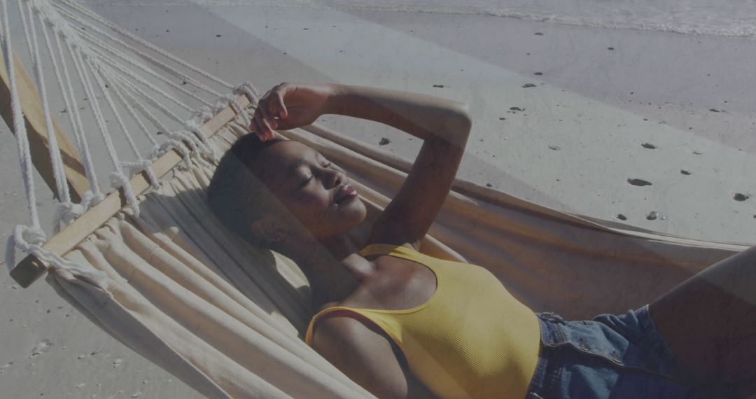Woman Relaxing in Hammock on Serene Beach