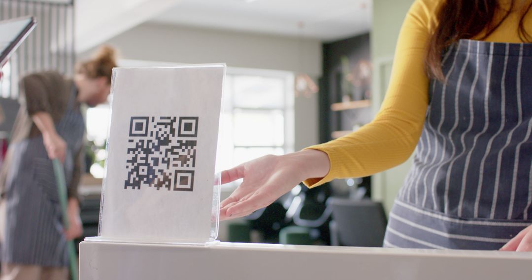 Waitress Pointing at Restaurant's QR Code for Online Menu - Free Images, Stock Photos and Pictures on Pikwizard.com