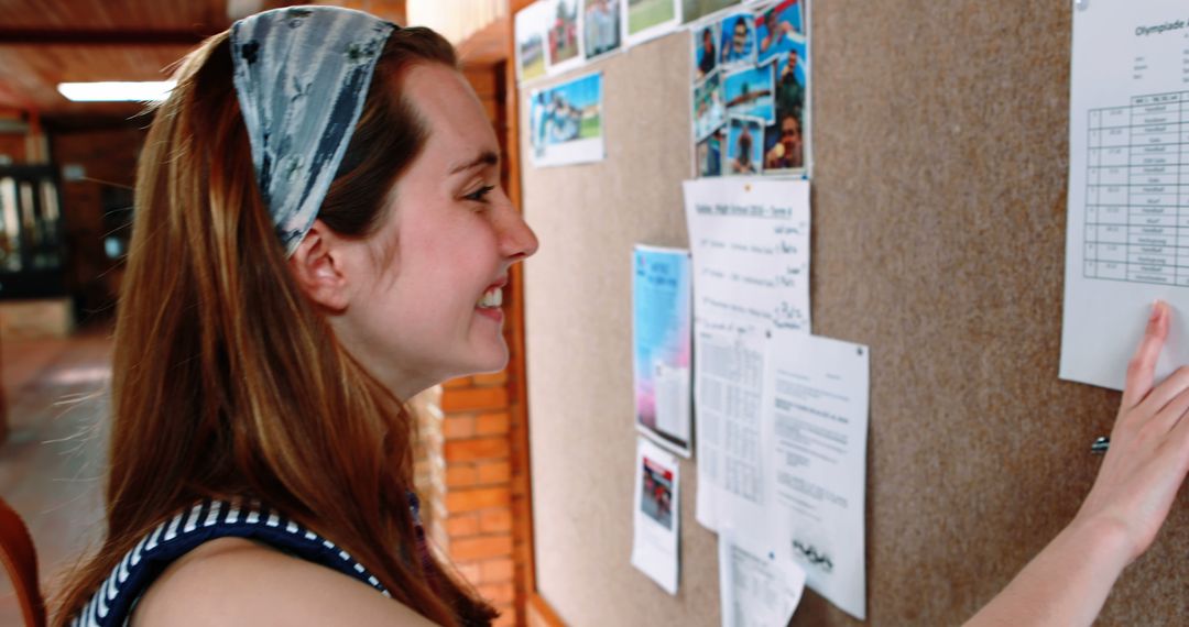 Happy student checking exam results on notice board - Free Images, Stock Photos and Pictures on Pikwizard.com