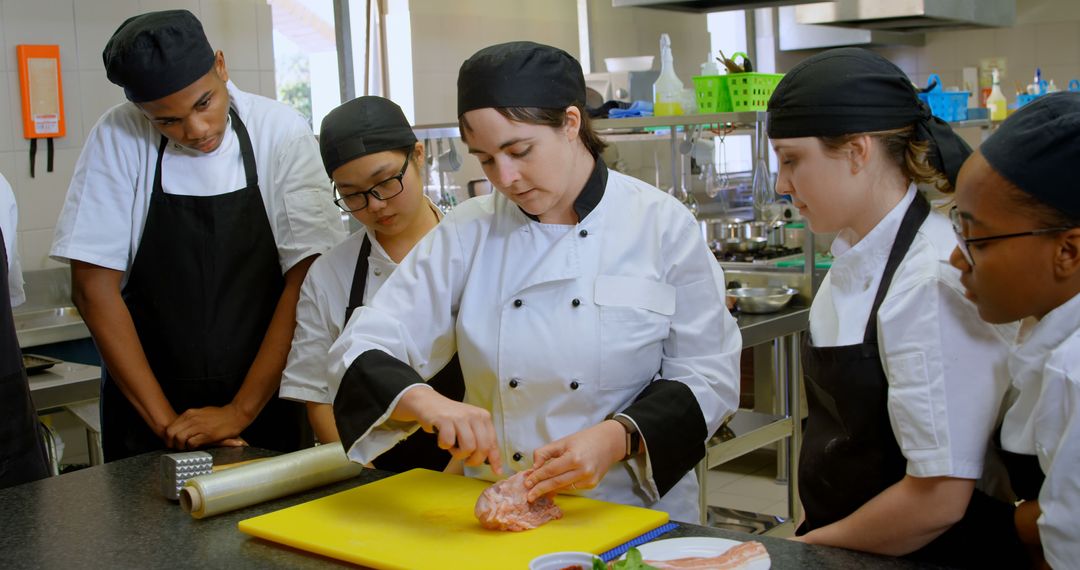 Chef Instructing Diverse Culinary Students in Professional Kitchen - Free Images, Stock Photos and Pictures on Pikwizard.com