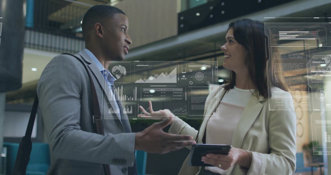 Colleagues Discuss Holographic Data in Modern Lobby
