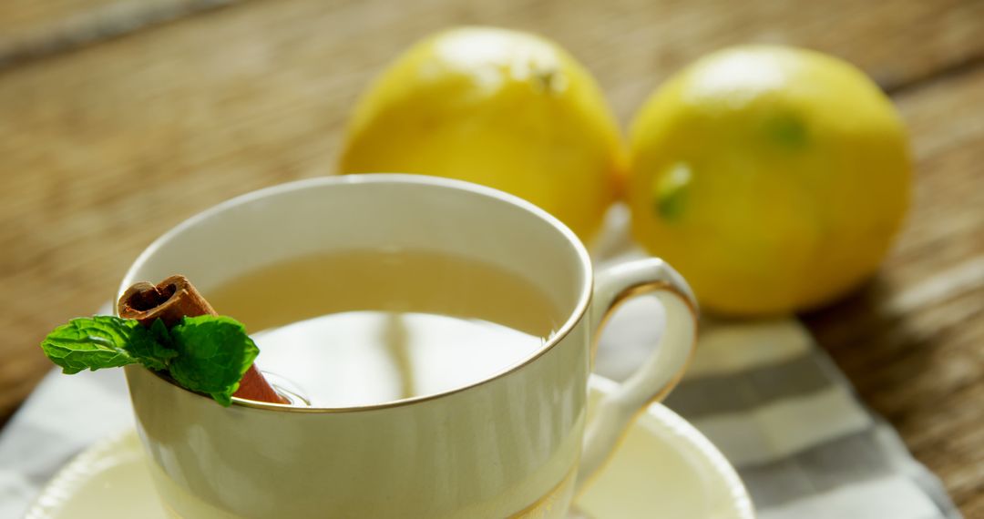 A warm, garnished tea with lemons offers a cozy, soothing atmosphere. - Free Images, Stock Photos and Pictures on Pikwizard.com