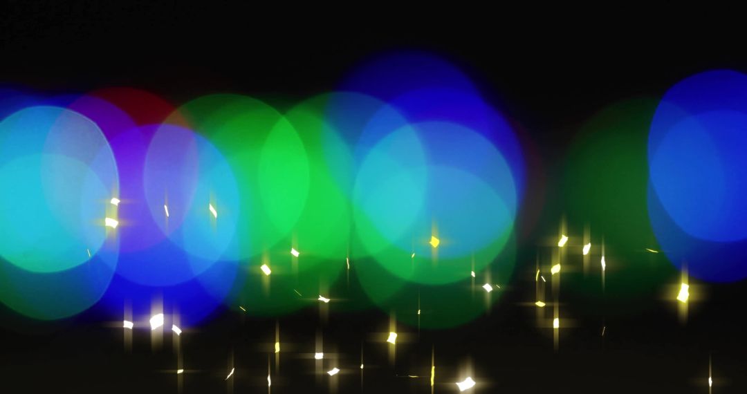 Colorful Light Bokeh with Starburst on Black Background