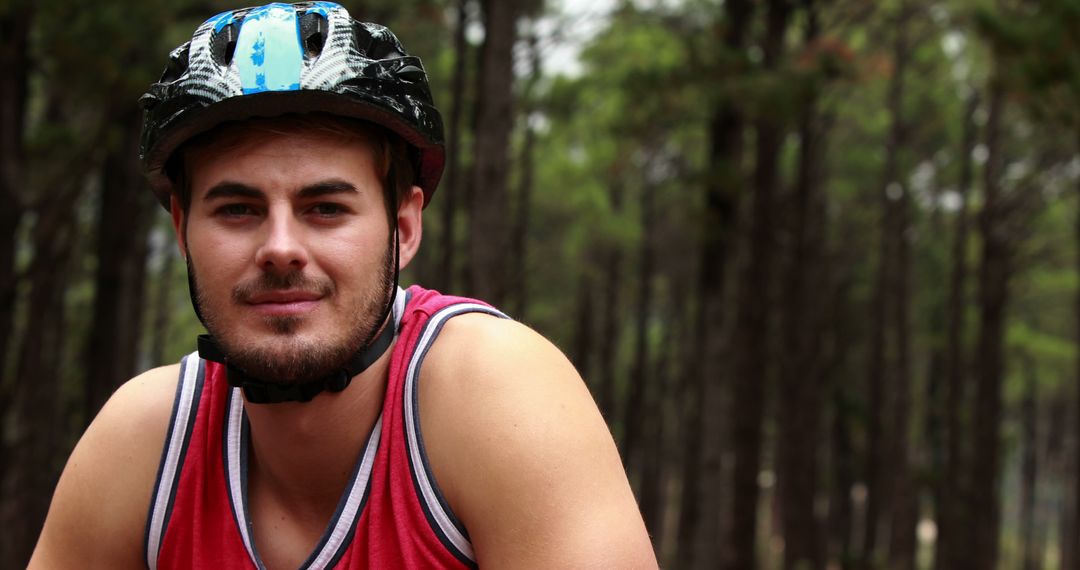 Man Sporting Helmet in Forest While Mountain Biking - Free Images, Stock Photos and Pictures on Pikwizard.com