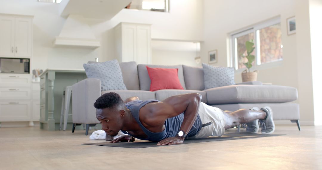 Fit African American Man Doing Push-ups at Home - Free Images, Stock Photos and Pictures on Pikwizard.com