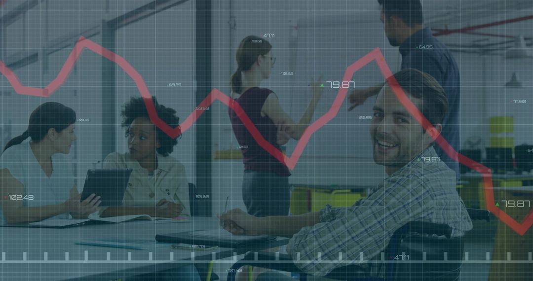 Smiling man in wheelchair collaborating with team in office with data graph overlay