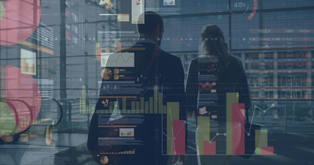 Business Professionals Analyzing Virtual Data and Graphs in Modern Office