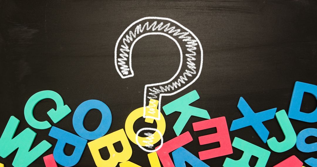 Chalk Drawn Question Mark Amidst Colorful Letters on Blackboard