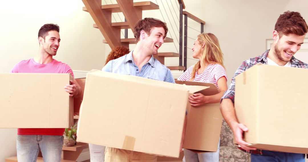 Group of Friends Moving into New Home, Carrying Boxes Cheerfully - Free Images, Stock Photos and Pictures on Pikwizard.com