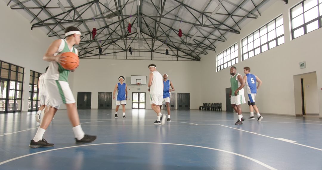 Basketball Game with Diverse Team in Indoor Gym