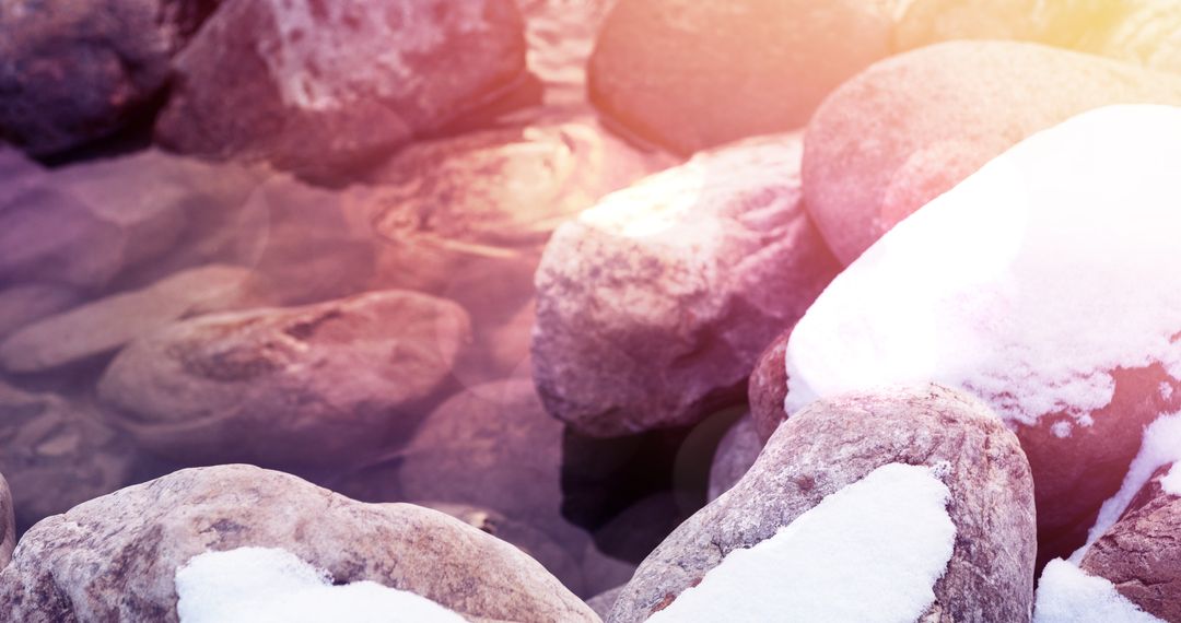 Snow-Covered Stones in Winter Stream with Frosty Highlights