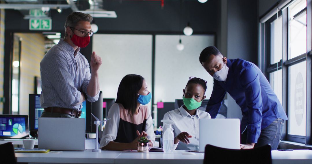 Diverse Business Team Collaborating in Office with Masks - Free Images, Stock Photos and Pictures on Pikwizard.com