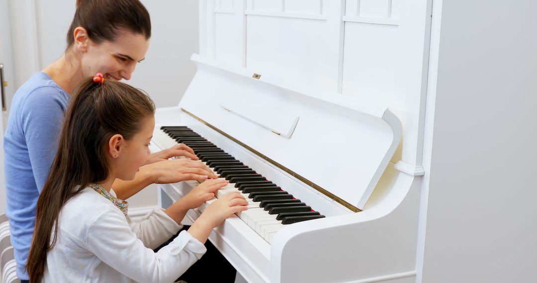 Mother and Daughter Playing Piano Together Joyfully - Free Images, Stock Photos and Pictures on Pikwizard.com