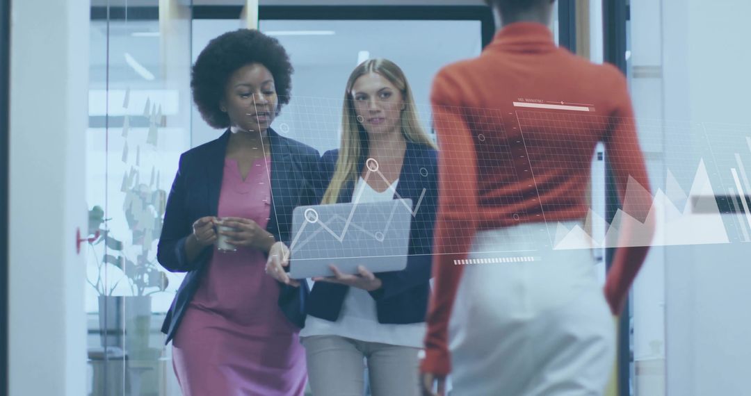 Diverse Colleagues Analyzing Business Charts in Modern Office