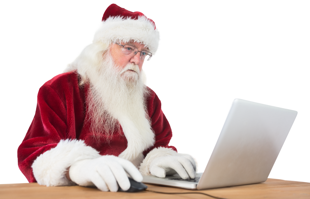 Transparent Santa Claus using laptop on wooden table - Download Free Stock Images Pikwizard.com