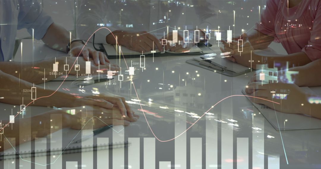 Team Analyzing Financial Data with Digital Chart Overlay