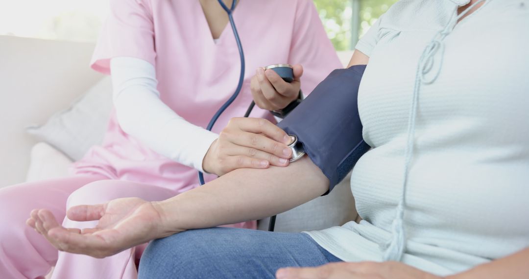 In-Home Healthcare: Nurse Monitoring Patient's Blood Pressure