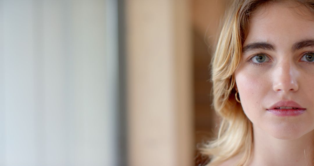 Woman Gazing in Natural Light with Subtle Expression