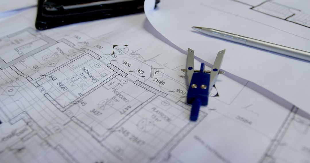 Architectural Blueprints with Compass and Pen on Desk - Free Images, Stock Photos and Pictures on Pikwizard.com