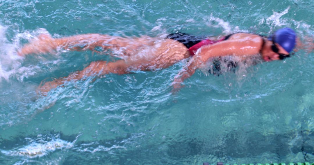 Female Swimmer Practicing Freestyle Stroke in Competitive Pool - Free Images, Stock Photos and Pictures on Pikwizard.com